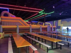 a large room with benches and a slide